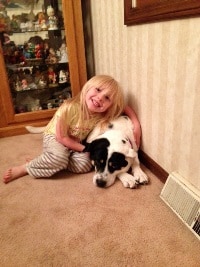 Girl with black and white dog adopted from the Tuscarawas County Humane Society