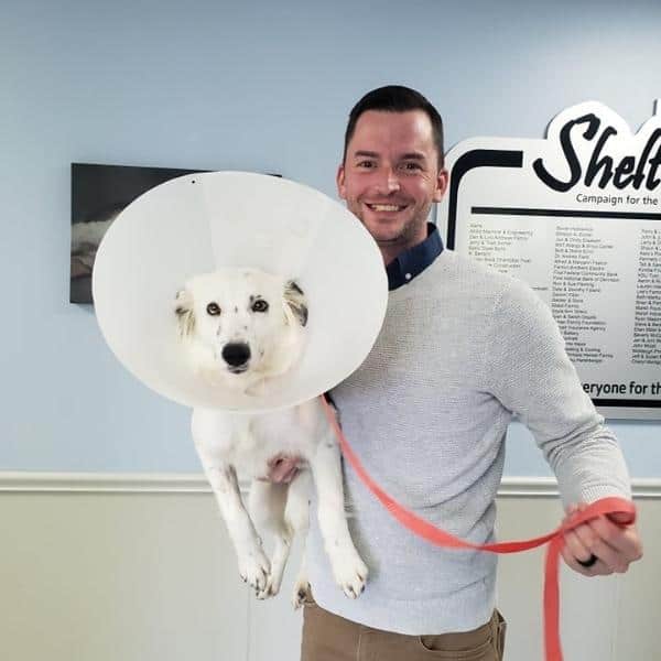 Man holding a dog